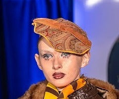 Paisley pill-style hat in orange and brown